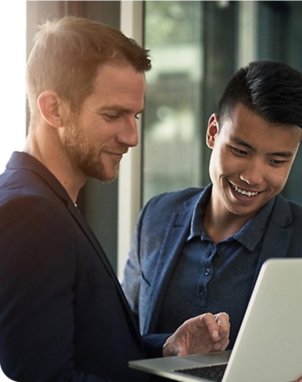 Sales team looking at laptop